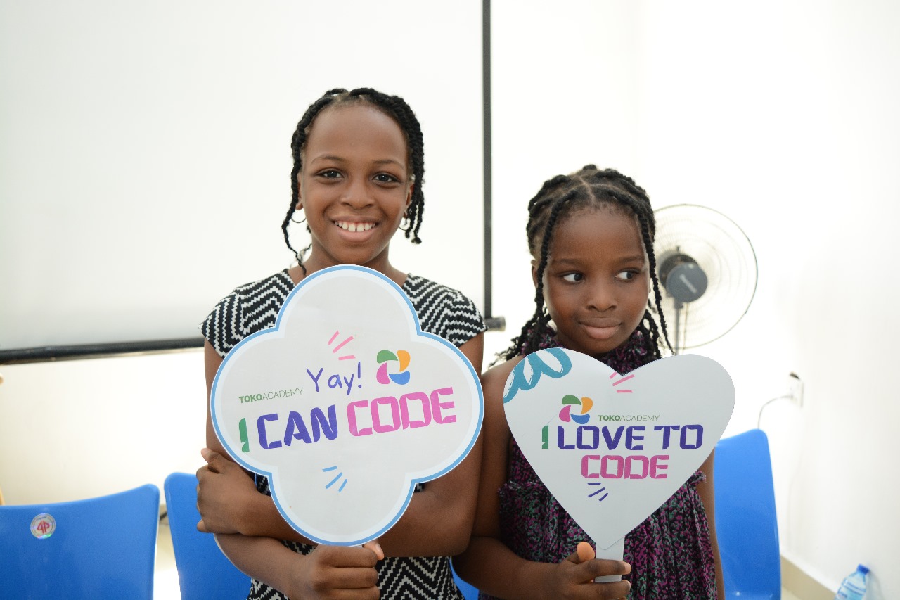 Toko Academy Children Holding plaque cards saying I can code